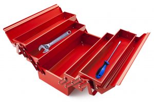 money manager concept of red tool box with a wrench and screw driver