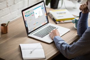 finance checklist concept of a person working on a laptop